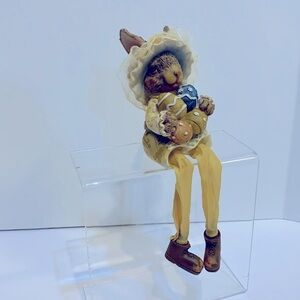 Sitting bunny resin figurine swinging legs